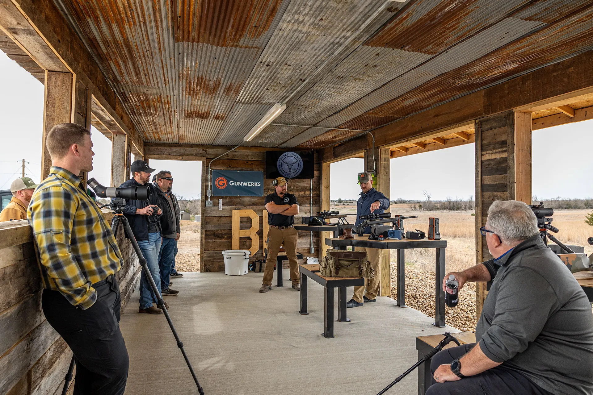 Group of people talking at the Long Range University by Gunwerks